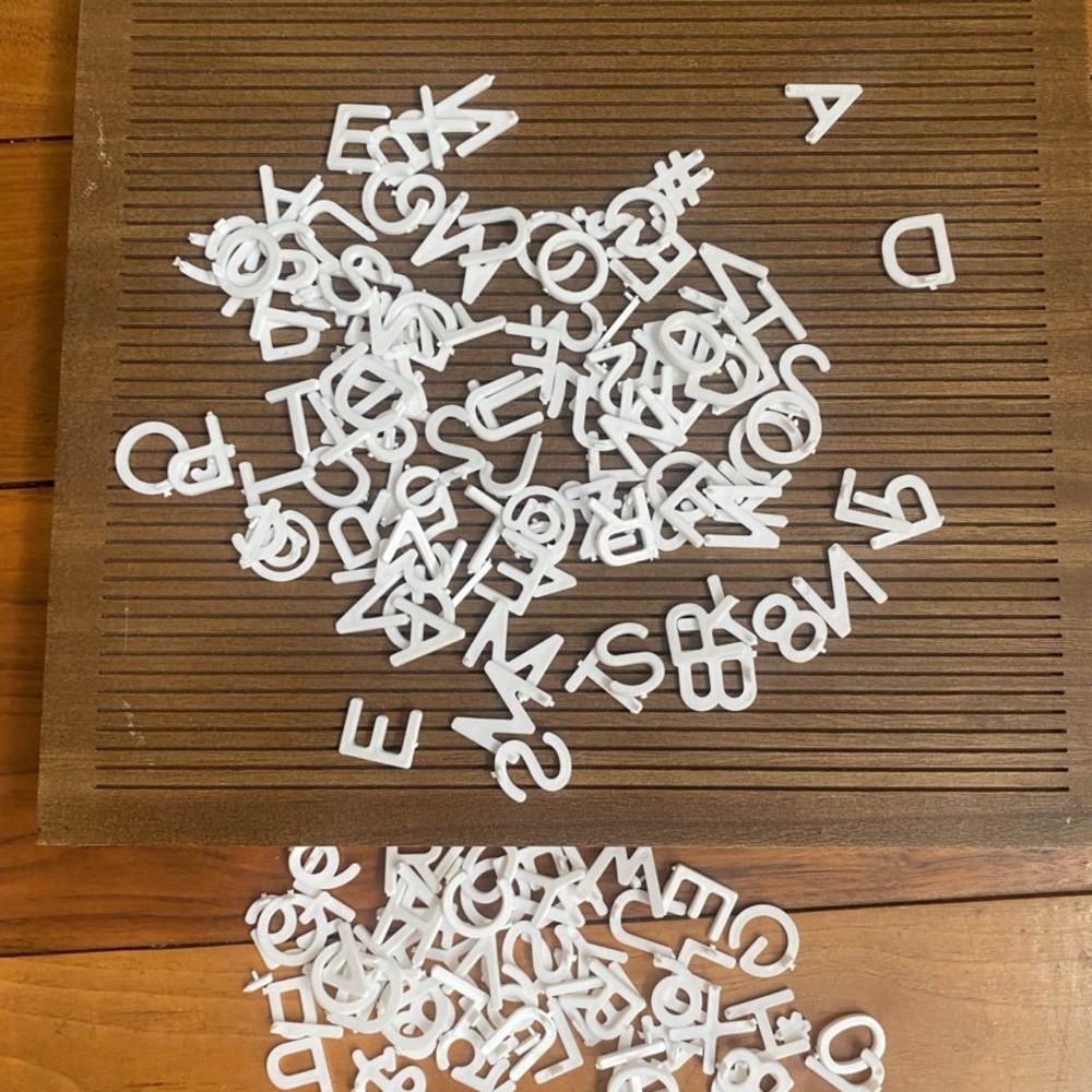Wooden display board with letters